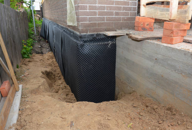 SJ Waterproofing Pros technician performing targeted Vapor Barrier Installation assessment in Porterfield, WI